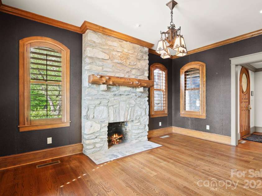 1245 Laurel Lane, Blowing Rock, NC 28605.  MLS# CAR4228582, YatesRealty ID 19780. Study/den connected to main floor living area- many potential uses! Half Bath across hall....