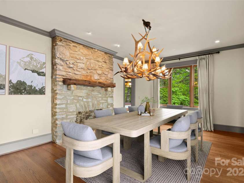 1245 Laurel Lane, Blowing Rock, NC 28605.  MLS# CAR4228582, YatesRealty ID 19780. (Virtual Staging). Dining w/ Stone Fireplace, connected to kitchen & living....