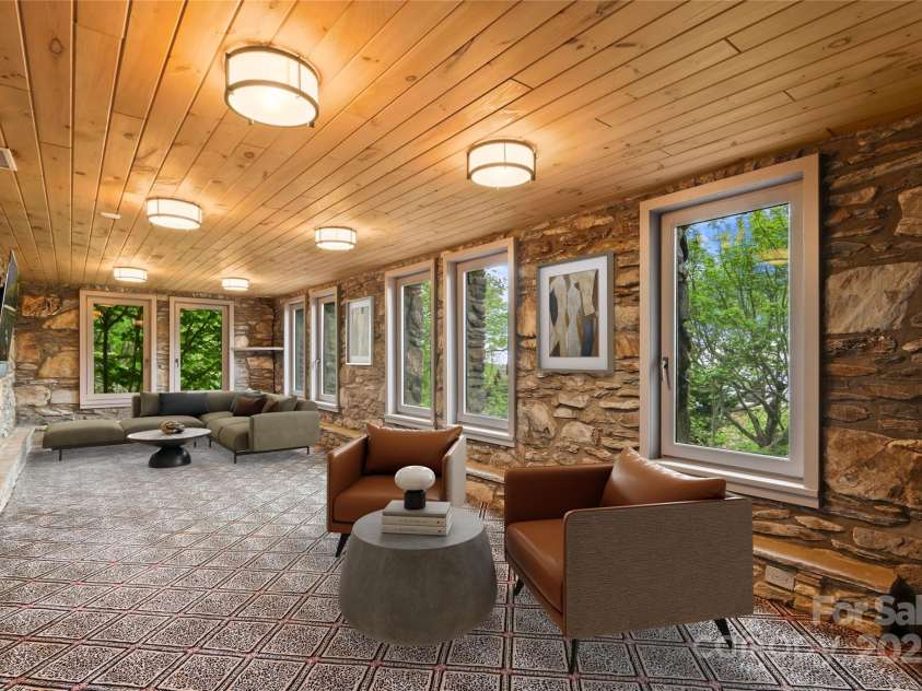 1245 Laurel Lane, Blowing Rock, NC 28605.  MLS# CAR4228582, YatesRealty ID 19780. (Virtual Staging). Lower level living w/ stone walls, gorge views....