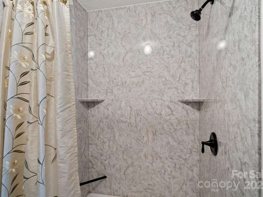 5826 Boxer Drive, Iron Station, NC 28080.  MLS# CAR4214978, YatesRealty ID 1979. Brand new custom primary shower!