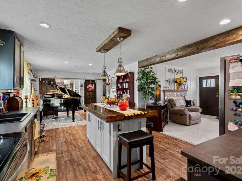 5826 Boxer Drive, Iron Station, NC 28080.  MLS# CAR4214978, YatesRealty ID 1979. Kitchen, Livingroom and Breakfast area or Dining Area (Piano)
