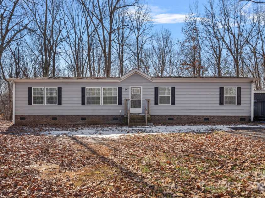 5826 Boxer Drive, Iron Station, NC 28080.  MLS# CAR4214978, YatesRealty ID 1979. Street View Cleared with Trees