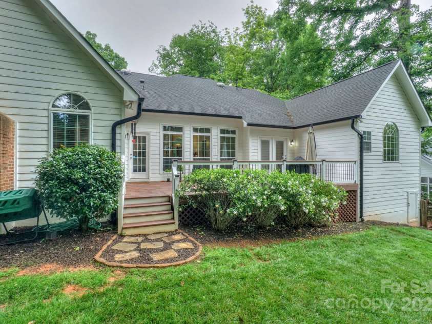 14831 Charterhouse Lane, Huntersville, NC 28078.  MLS# CAR4264707, YatesRealty ID 19794. Back of home showing the back deck