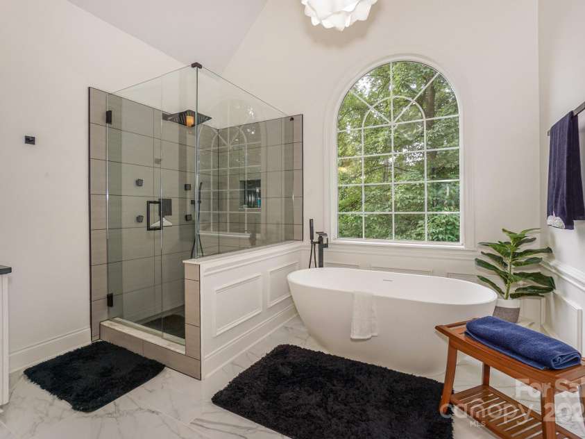 14831 Charterhouse Lane, Huntersville, NC 28078.  MLS# CAR4264707, YatesRealty ID 19794. Beautiful walk in shower and free standing tub in the Primary bath