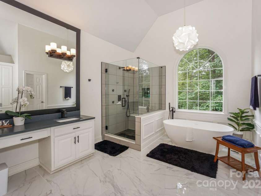 14831 Charterhouse Lane, Huntersville, NC 28078.  MLS# CAR4264707, YatesRealty ID 19794. Double Vanity, custom framed mirror, upgraded lighting, free-standing tub, custom tiled shower with multiple shower accessories
