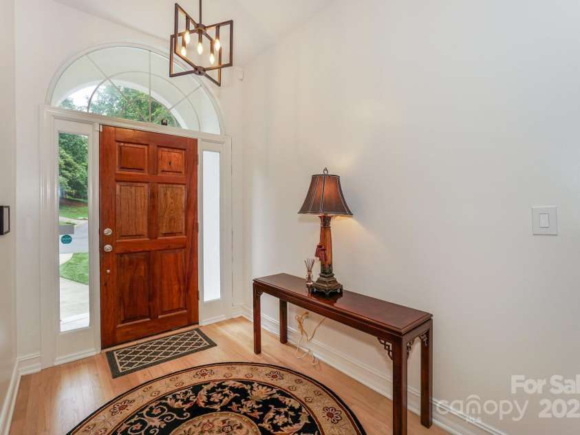 14831 Charterhouse Lane, Huntersville, NC 28078.  MLS# CAR4264707, YatesRealty ID 19794. Entry hall reflecting upgraded lighting and newly refinished flooring