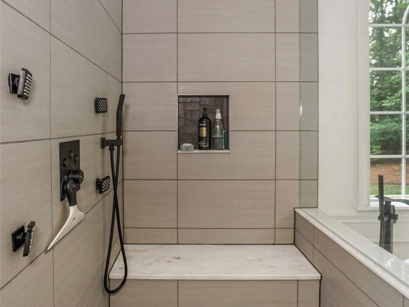 14831 Charterhouse Lane, Huntersville, NC 28078.  MLS# CAR4264707, YatesRealty ID 19794. Feels like your at a spa retreat in this custom tiled shower w/ seating