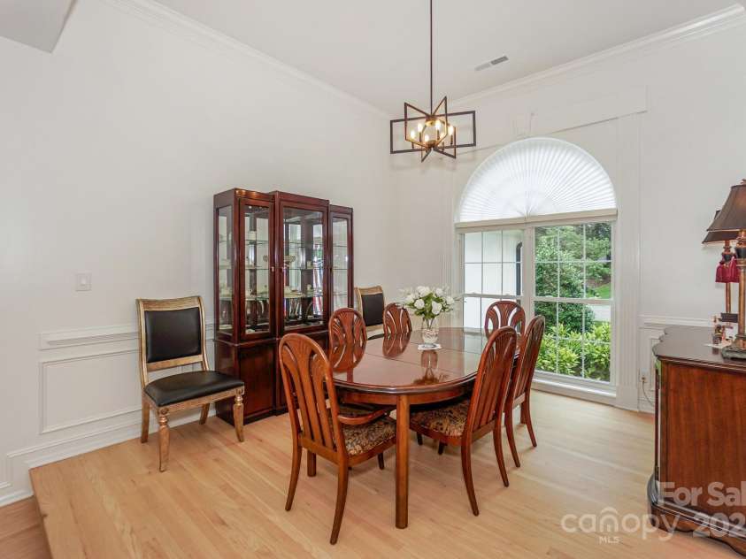14831 Charterhouse Lane, Huntersville, NC 28078.  MLS# CAR4264707, YatesRealty ID 19794. Step up to the large Formal Dining room with floor to ceiling windows, new lighting, and a high ceiling