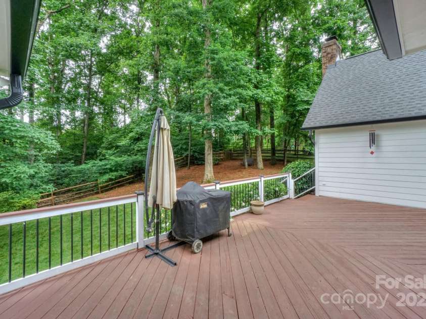 14831 Charterhouse Lane, Huntersville, NC 28078.  MLS# CAR4264707, YatesRealty ID 19794. View from the oversized deck looking into the private and wooded backyard that backs up to additional wooded common area