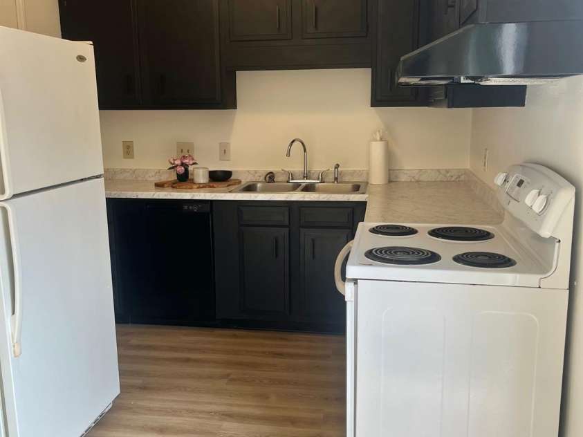 4520 Central Avenue, Charlotte, NC 28205.  MLS# CAR4231851, YatesRealty ID 19799. Kitchen Laundry room door is on the other side of refrigerator