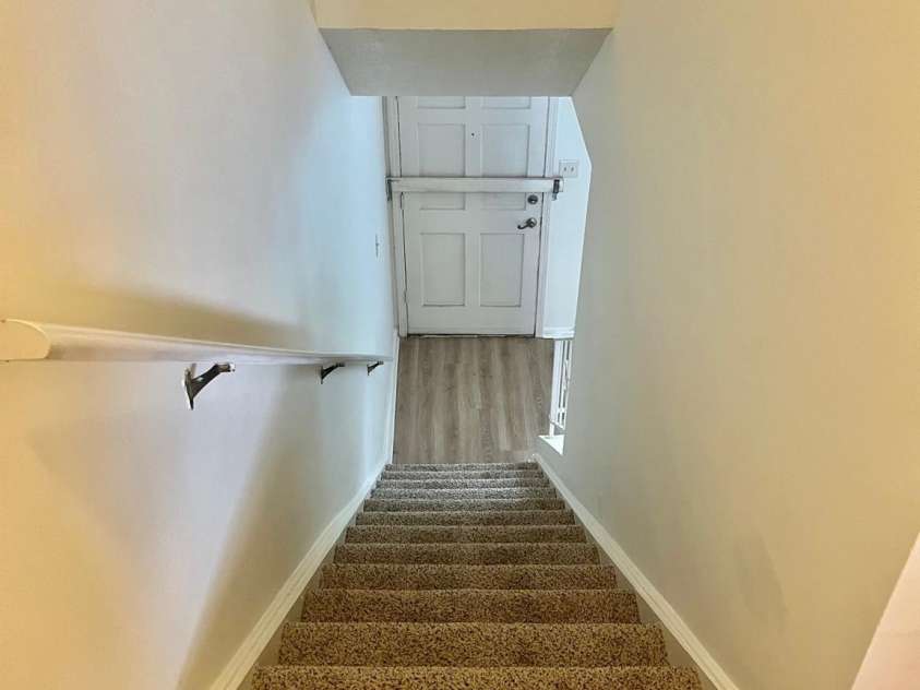 4520 Central Avenue, Charlotte, NC 28205.  MLS# CAR4231851, YatesRealty ID 19799. Stairs from upstairs landing