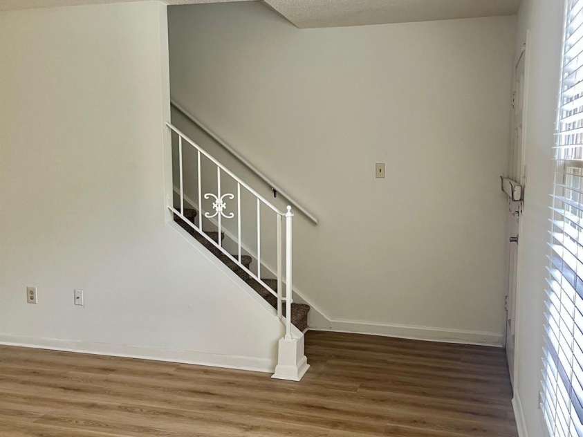 4520 Central Avenue, Charlotte, NC 28205.  MLS# CAR4318622, YatesRealty ID 19799. Living Stairs, Front door is across from stairs