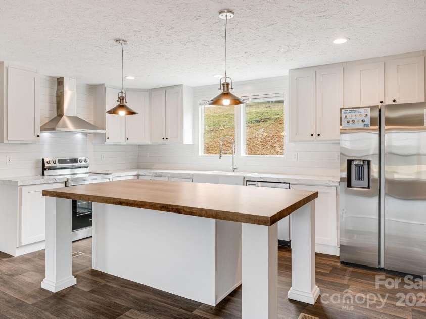 96 Sandons Trail, Marshall, NC 28753.  MLS# CAR4224480, YatesRealty ID 19813. Oversized kitchen Island