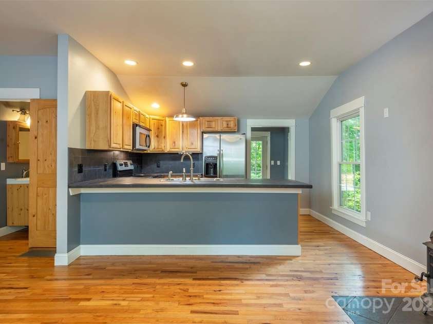 379 Rainbow Terrace, Black Mountain, NC 28711.  MLS# CAR4267468, YatesRealty ID 19819. Large open living room. and kitchen