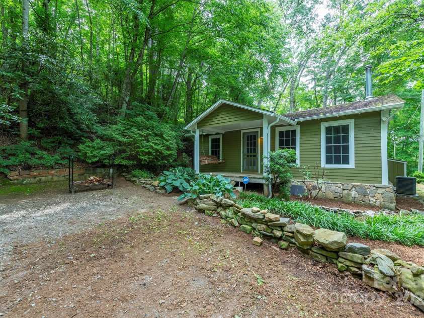 379 Rainbow Terrace, Black Mountain, NC 28711.  MLS# CAR4267468, YatesRealty ID 19819. Rocking chair porch great for watching the rain
