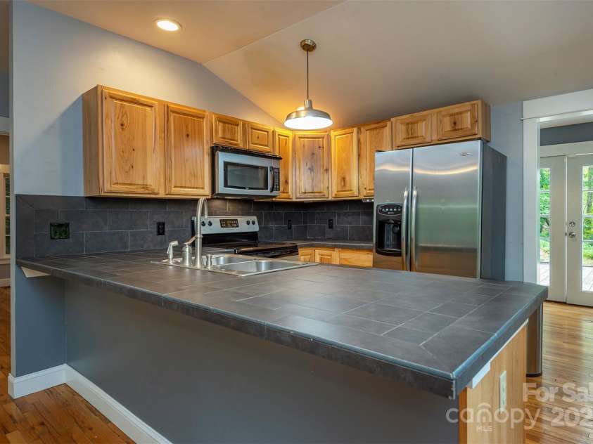 379 Rainbow Terrace, Black Mountain, NC 28711.  MLS# CAR4267468, YatesRealty ID 19819. Updated open kitchen