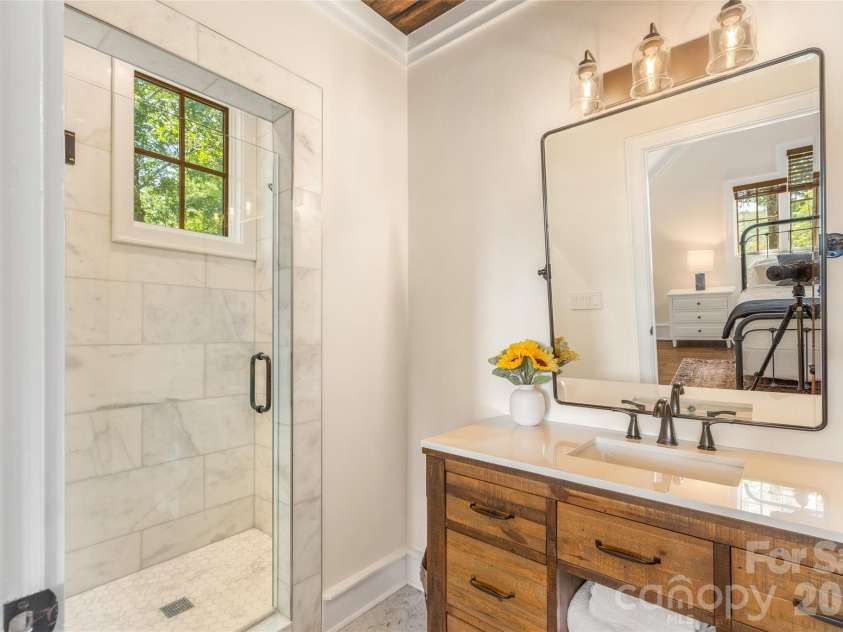 48 Bearfoot Lane, Highlands, NC 28741.  MLS# CAR4379845, YatesRealty ID 19825. Ensuite Guest Bath 1