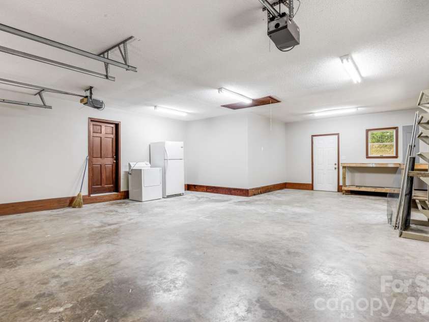 35 Byrd Road, Candler, NC 28715.  MLS# CAR4379213, YatesRealty ID 19829. Workshop area in garage