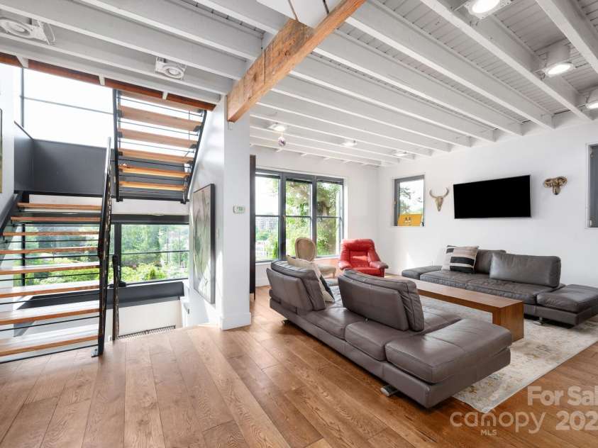 53 Buchanan Place, Asheville, NC 28801.  MLS# CAR4257148, YatesRealty ID 19830. View of living area with open stairwell