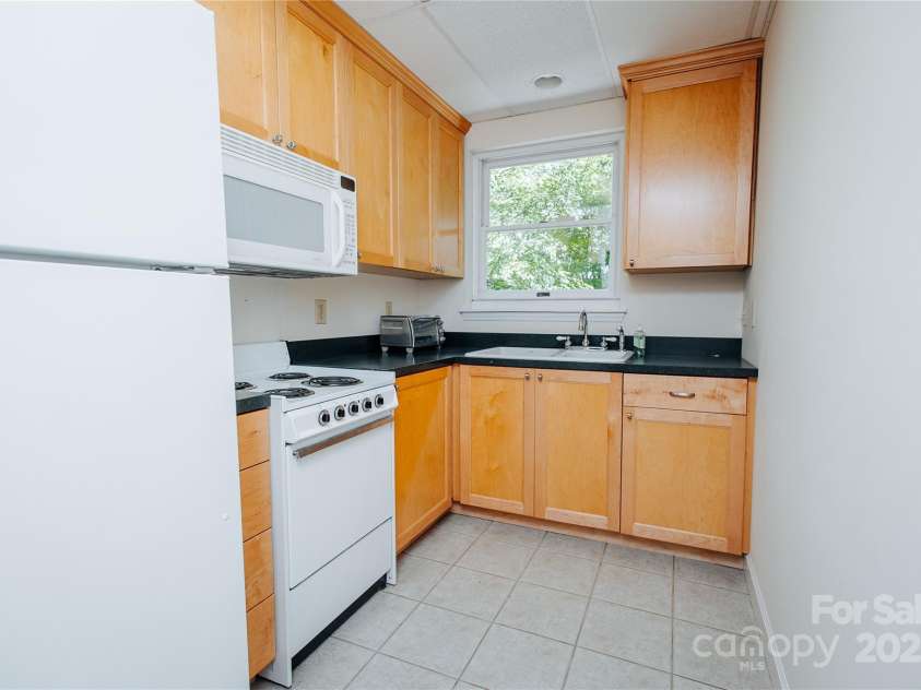 277 Forest Road, Marion, NC 28752.  MLS# CAR4252447, YatesRealty ID 19831. Another view of lower level kitchen