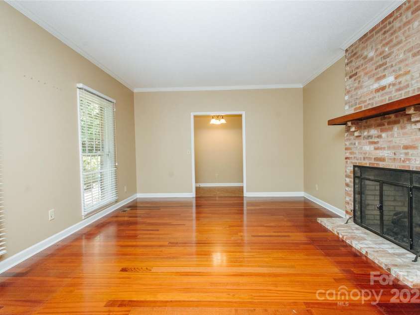 277 Forest Road, Marion, NC 28752.  MLS# CAR4252447, YatesRealty ID 19831. Beautiful Living room with HW floors and propane gas FP