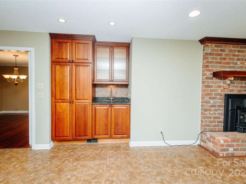 277 Forest Road, Marion, NC 28752.  MLS# CAR4252447, YatesRealty ID 19831. Den off of kitchen has more cabinetry with a wet bar.