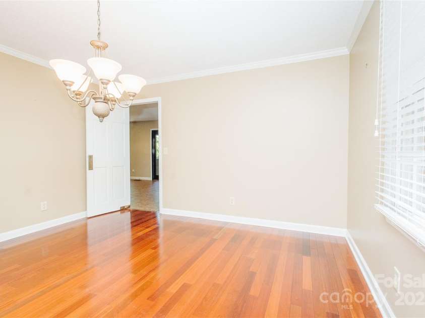 277 Forest Road, Marion, NC 28752.  MLS# CAR4252447, YatesRealty ID 19831. Dining room opens into kitchen; It has great shutters on the windows.