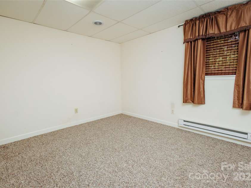 277 Forest Road, Marion, NC 28752.  MLS# CAR4252447, YatesRealty ID 19831. Lower level bedroom