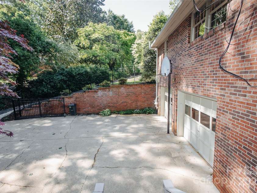 277 Forest Road, Marion, NC 28752.  MLS# CAR4252447, YatesRealty ID 19831. Side view of home