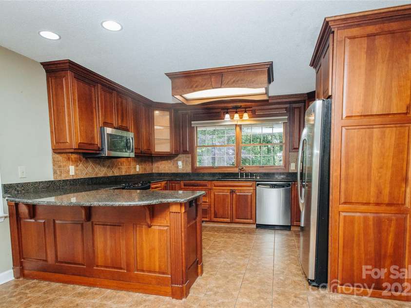 277 Forest Road, Marion, NC 28752.  MLS# CAR4252447, YatesRealty ID 19831. The area this side of kitchen is a great place to add a small table and chairs