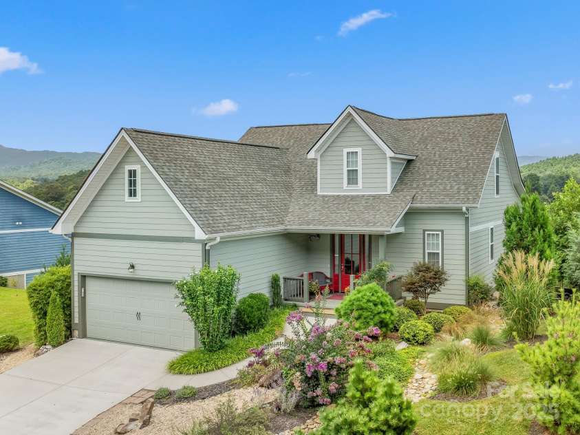 50 Rose Creek Road, Leicester, NC 28748.  MLS# CAR4228303, YatesRealty ID 19833. Covered front porch and extensive landscaping
