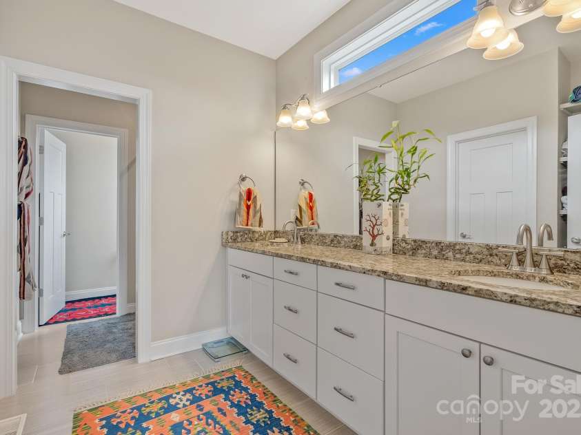 50 Rose Creek Road, Leicester, NC 28748.  MLS# CAR4228303, YatesRealty ID 19833. Double basin vanity and plenty of counter space