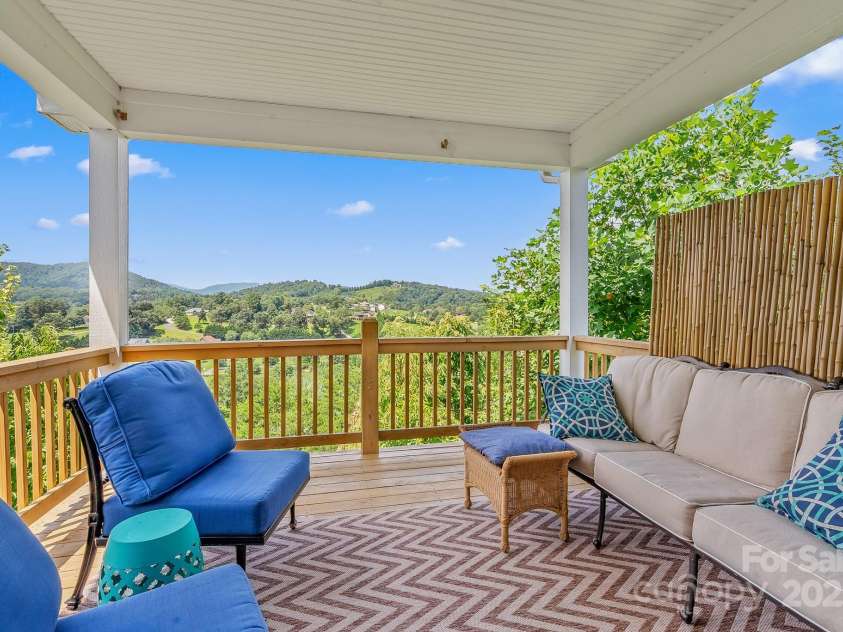 50 Rose Creek Road, Leicester, NC 28748.  MLS# CAR4228303, YatesRealty ID 19833. Feel on top of the world under your covered back deck