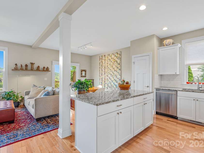 50 Rose Creek Road, Leicester, NC 28748.  MLS# CAR4228303, YatesRealty ID 19833. Granite countertop island is perfect for entertaining