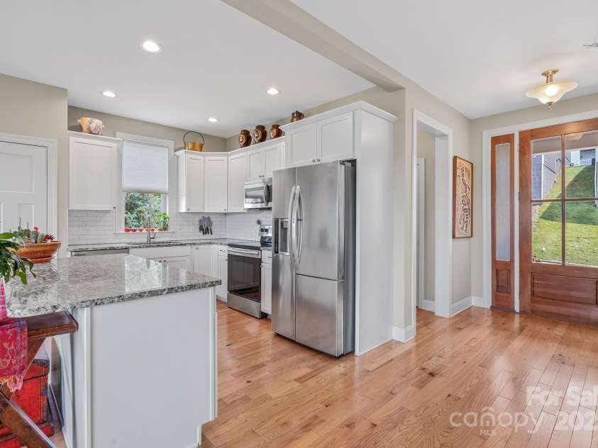 50 Rose Creek Road, Leicester, NC 28748.  MLS# CAR4228303, YatesRealty ID 19833. Kitchen has stainless steel appliances and recessed lighting