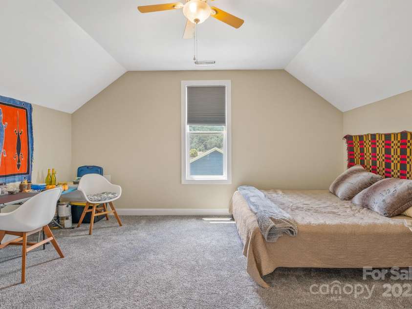 50 Rose Creek Road, Leicester, NC 28748.  MLS# CAR4228303, YatesRealty ID 19833. Oversized upstairs bedroom with tall ceiling