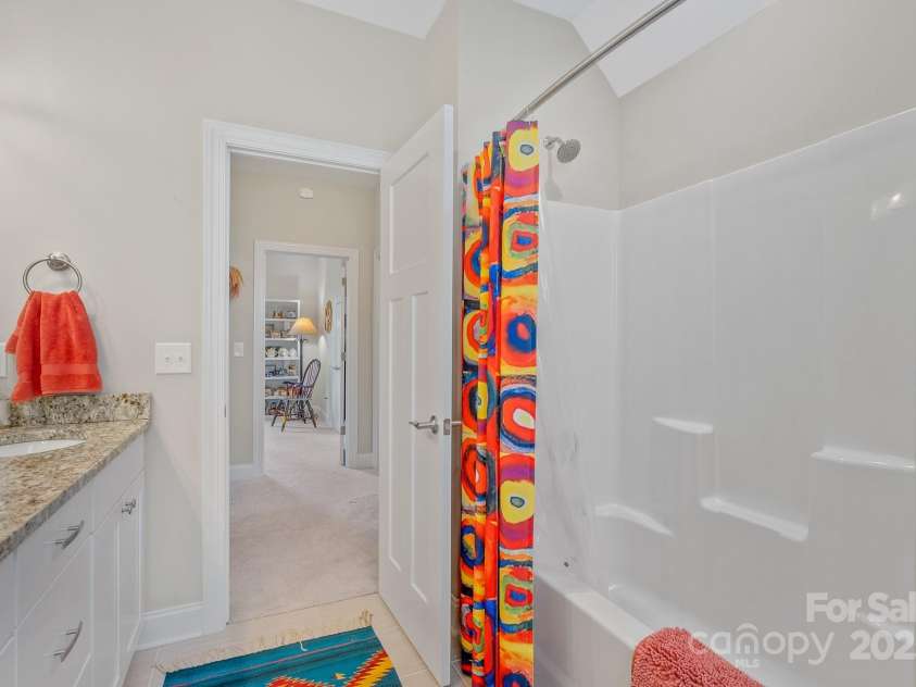 50 Rose Creek Road, Leicester, NC 28748.  MLS# CAR4228303, YatesRealty ID 19833. Shower-tub combination upstairs