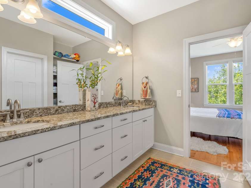 50 Rose Creek Road, Leicester, NC 28748.  MLS# CAR4228303, YatesRealty ID 19833. Transom window provides natural light