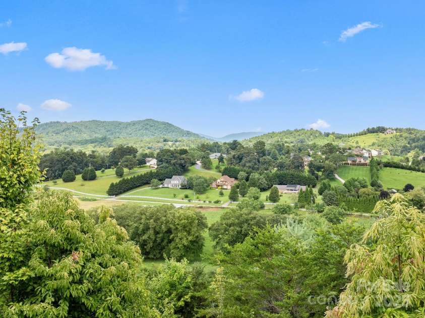 50 Rose Creek Road, Leicester, NC 28748.  MLS# CAR4228303, YatesRealty ID 19833. Unparalleled views