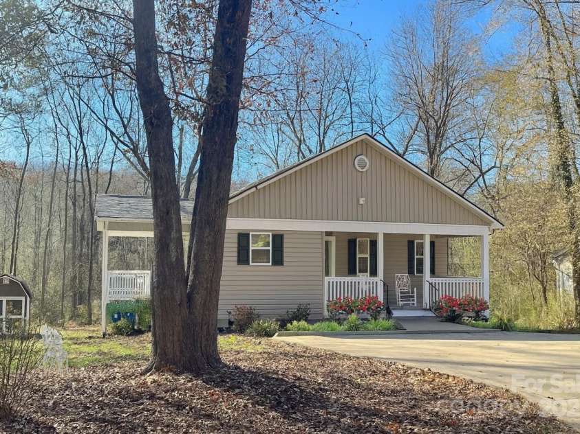 125 Woodland Circle, Rutherfordton, NC 28139.  MLS# CAR4326119, YatesRealty ID 19836. Chatgpt altered photo-original follows this pic.