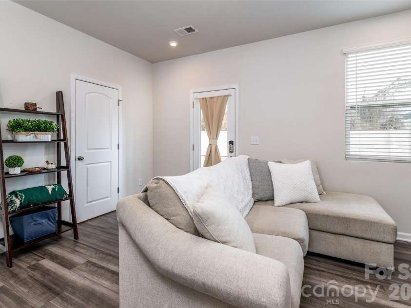 1206 Keydet Drive, Charlotte, NC 28216.  MLS# CAR4345736, YatesRealty ID 1984. 4th bedroom/flex space on first floor overlooking back patio!
