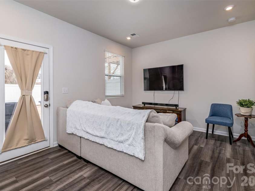 1206 Keydet Drive, Charlotte, NC 28216.  MLS# CAR4345736, YatesRealty ID 1984. 4th bedroom/flex space on first floor overlooking back patio!