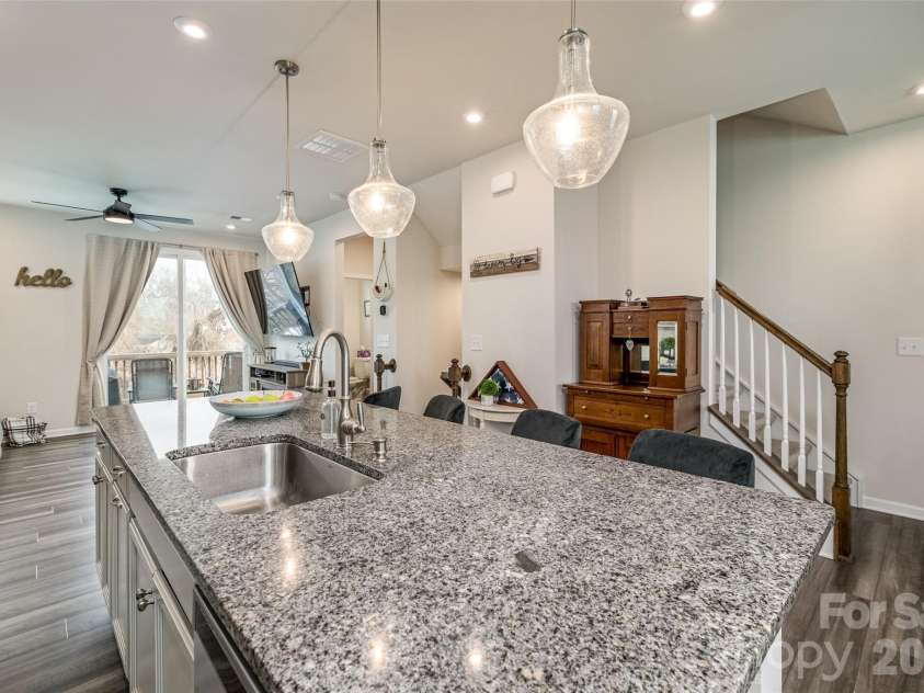 1206 Keydet Drive, Charlotte, NC 28216.  MLS# CAR4345736, YatesRealty ID 1984. Open concept kitchen area overlooking the great room and deck!