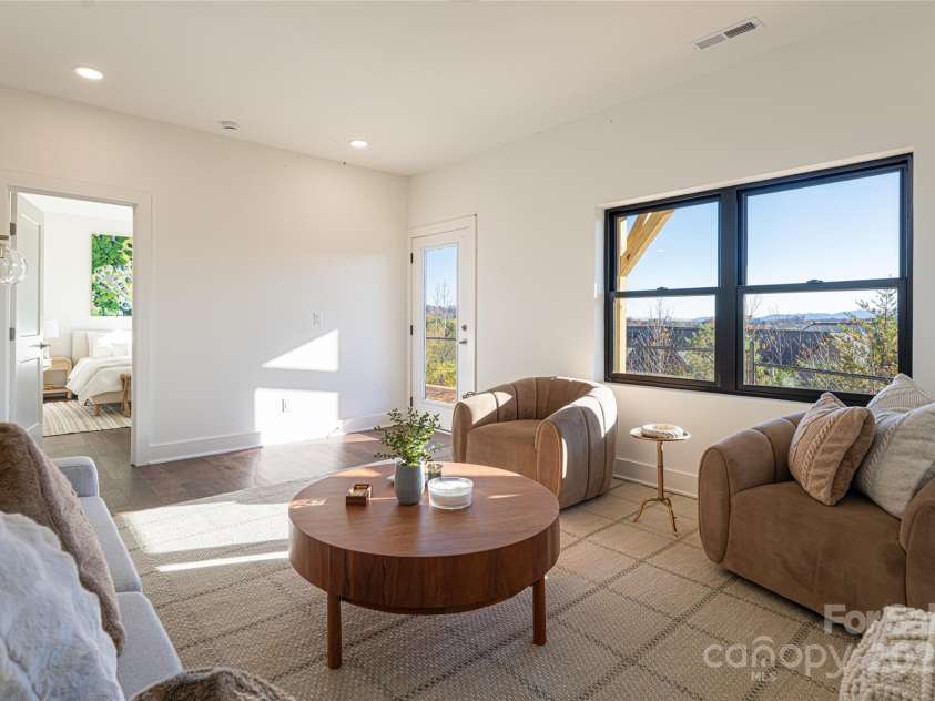 608 Storybook Villas Trail, Asheville, NC 28804.  MLS# CAR4294155, YatesRealty ID 1984. Lower level family room - Similar