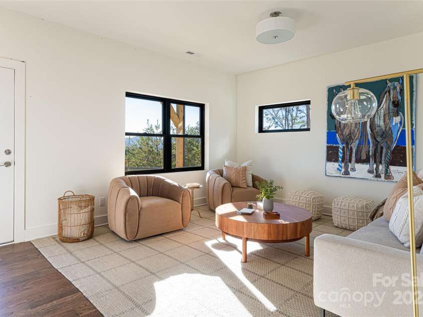 608 Storybook Villas Trail, Asheville, NC 28804.  MLS# CAR4294155, YatesRealty ID 1984. Lower level family room - Similar