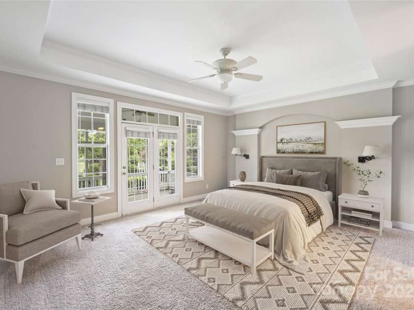 5940 Four Wood Drive, Matthews, NC 28104.  MLS# CAR4252079, YatesRealty ID 19844. Etreat-style primary with tray ceiling —private and serene.