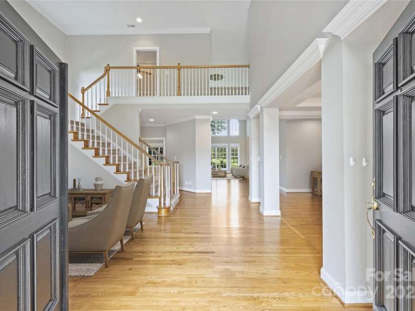 5940 Four Wood Drive, Matthews, NC 28104.  MLS# CAR4252079, YatesRealty ID 19844. Grand entry with soaring ceiling, site-finished hardwoods, and sightlines that draw you straight into the main living spaces