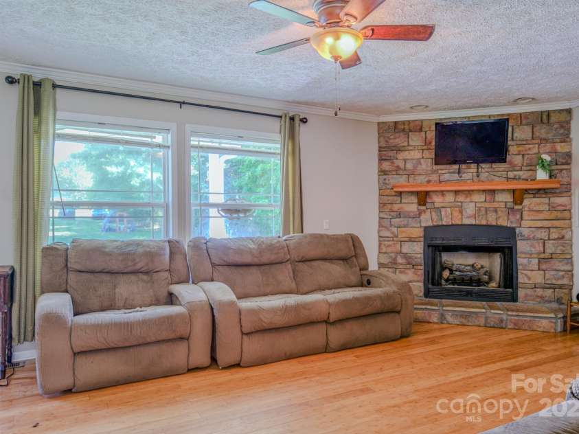 210 US 221A Highway, Forest City, NC 28043.  MLS# CAR4264127, YatesRealty ID 19853. Family room, fireplace with gas logs