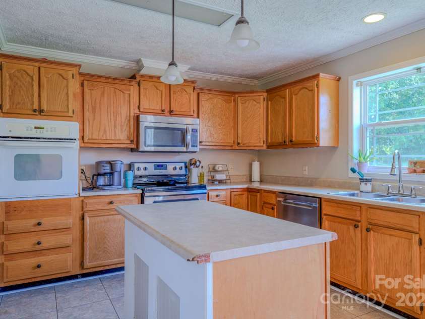 210 US 221A Highway, Forest City, NC 28043.  MLS# CAR4264127, YatesRealty ID 19853. Large, open kitchen with island