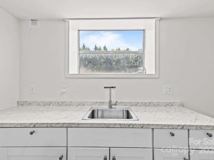 306 2nd Avenue Place, Conover, NC 28613.  MLS# CAR4270628, YatesRealty ID 19854. Kitchen in basement